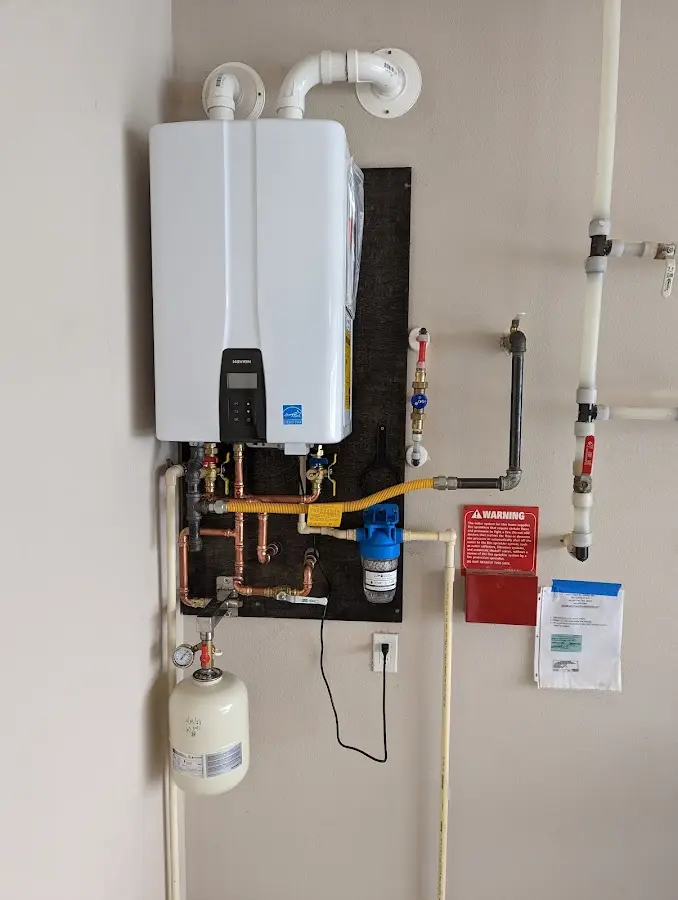 Professional plumber installing copper piping in a Kaunakakai home